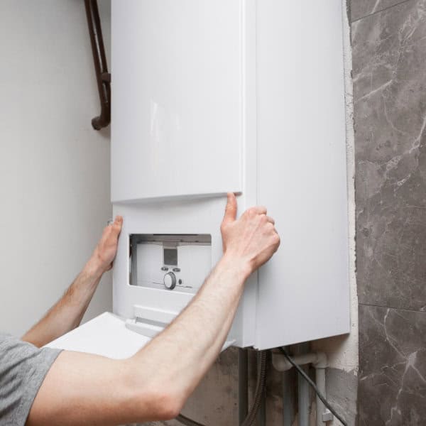 A new boiler being installed by a heating engineer in Buxton, SK17